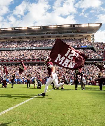 Football player carrying a flag
