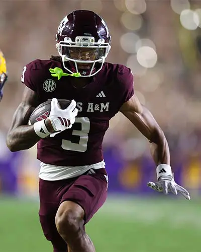 Portrait of Adam Sinn shaking hands