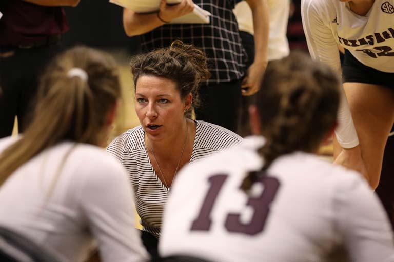 A coach talking to players