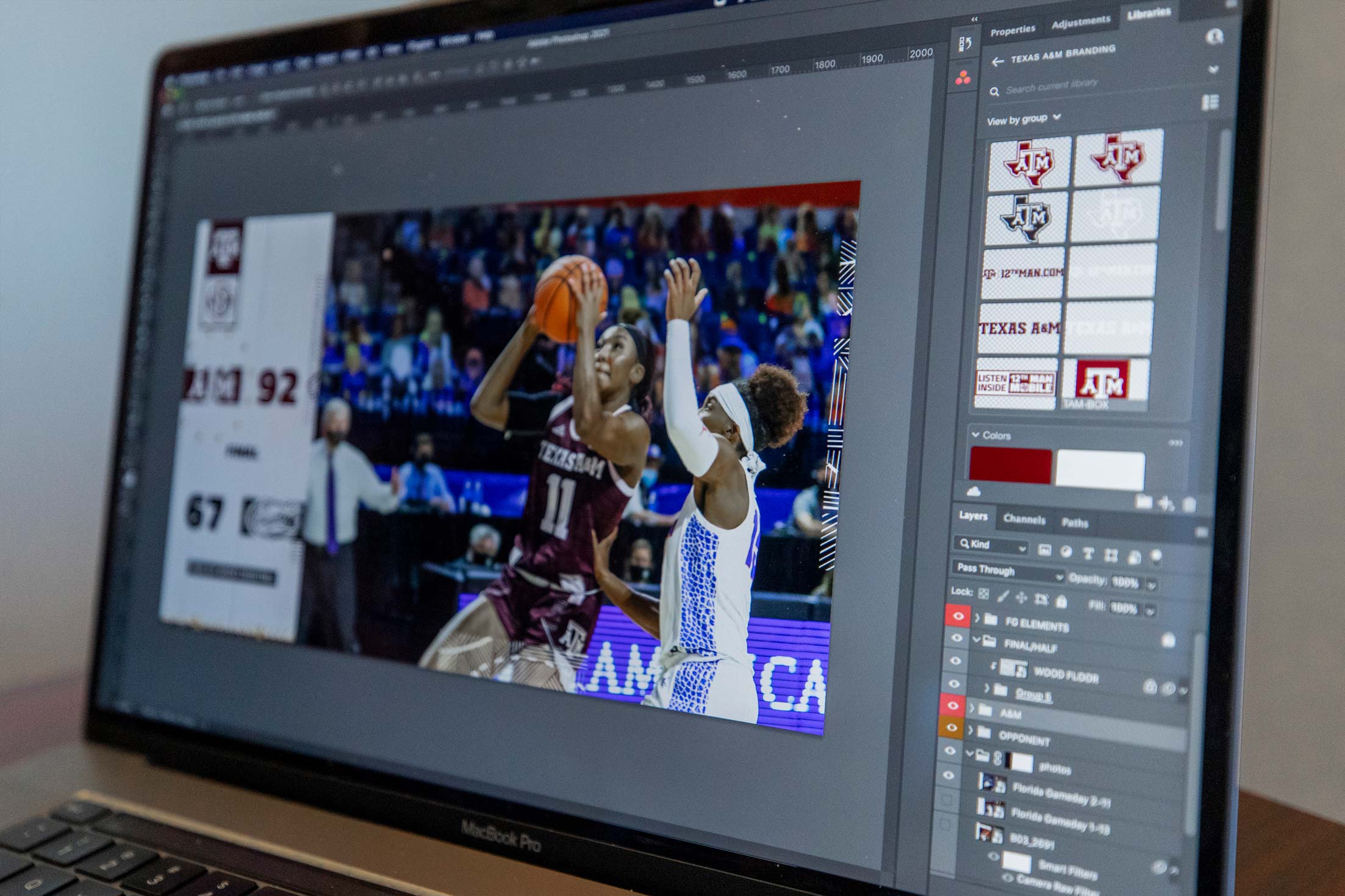 Laptop screen with a picture of women's basketball players on it