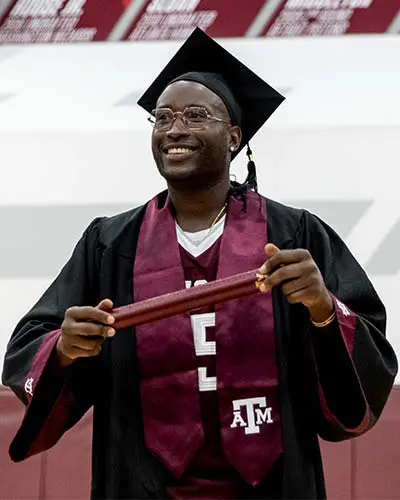 Portrait of Adam Sinn shaking hands