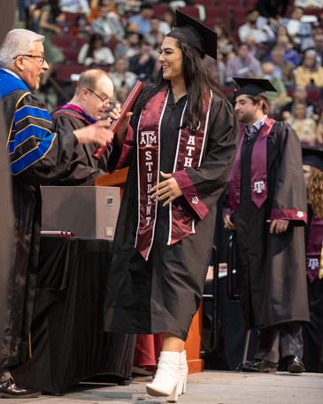 Haley Lee on the stage at graduation