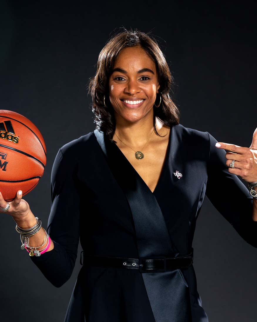 Joni Taylor holding a basketball