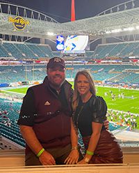 Crystal & David Watts at a football game