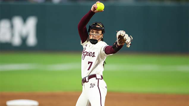 softball player pitching